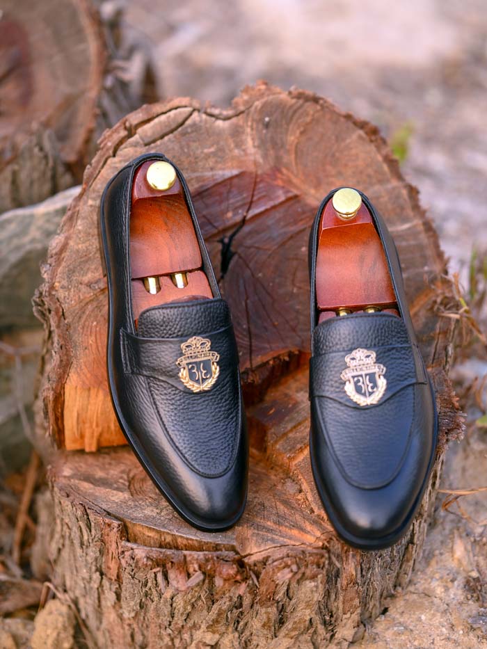 Black leather loafer - side profile showing sole