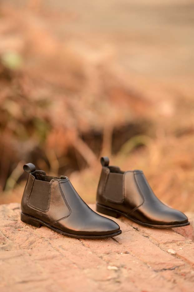 Men's black leather Chelsea boots styled outfit