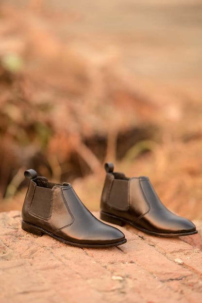 Men's black leather Chelsea boots styled outfit